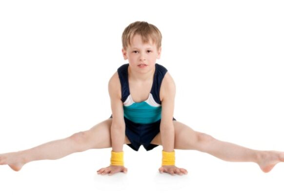 little boy gymnast doing exercises